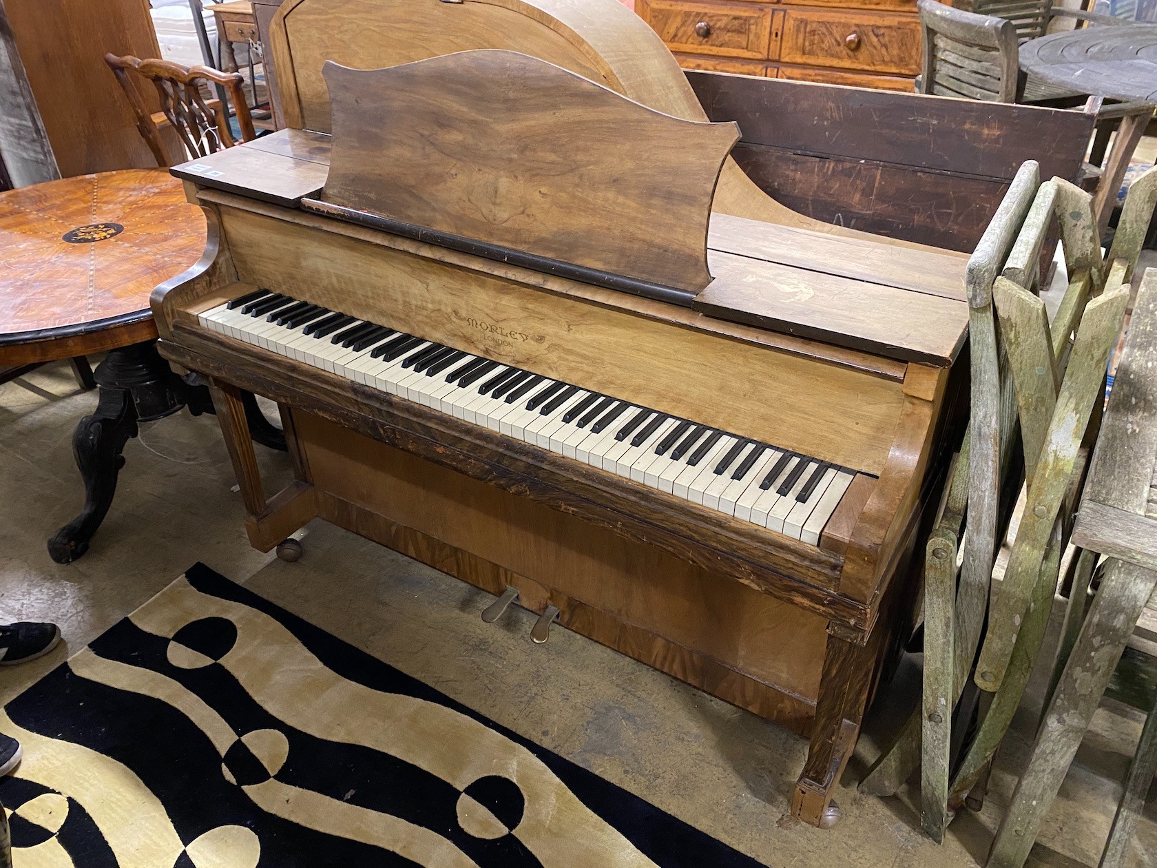 An early 20th century walnut cased upright grand piano by Morley of London, width 142cm
